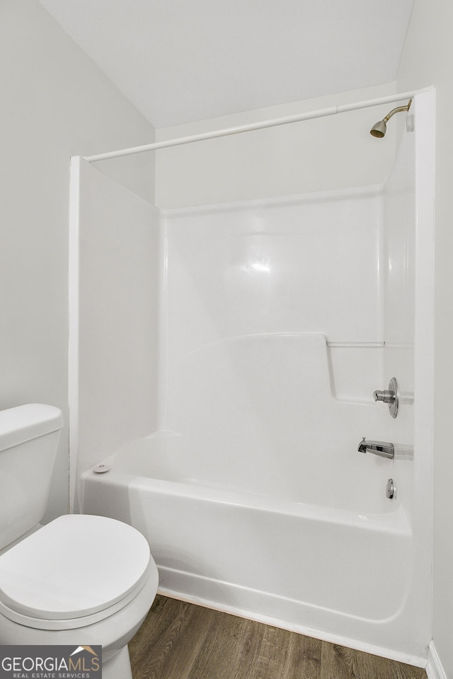 3682 Harvest Dr, Decatur, GA 30034 - bathroom with wood finished floors, toilet, and washtub / shower combination