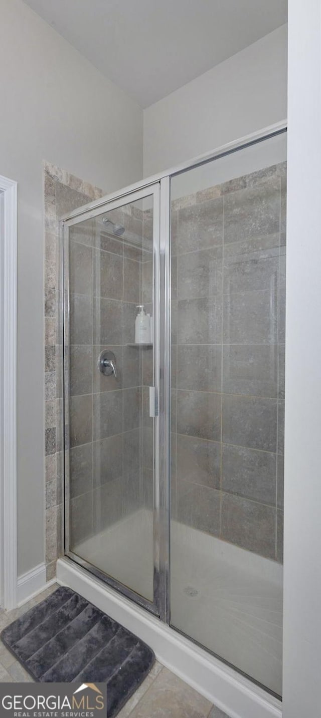 bathroom with a shower stall