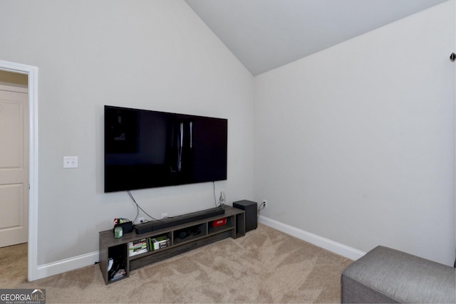 carpeted living room with baseboards and vaulted ceiling