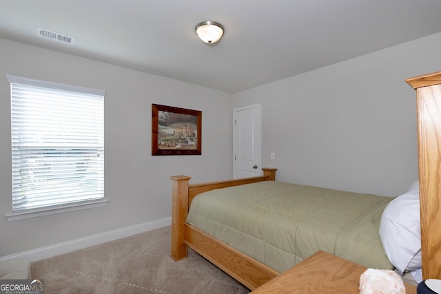 bedroom featuring carpet, visible vents, and baseboards