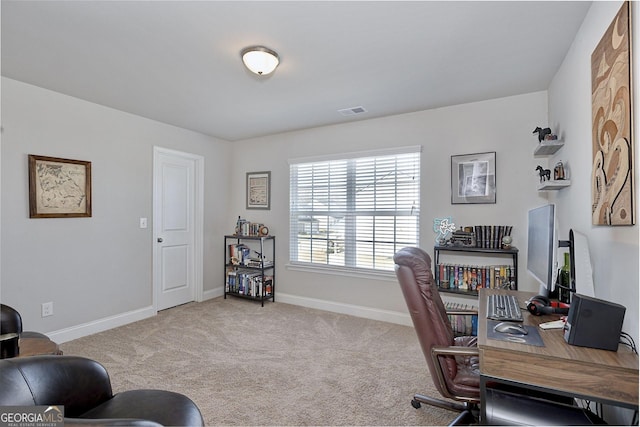 office area featuring visible vents, baseboards, and carpet