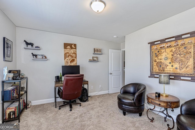 carpeted home office with baseboards