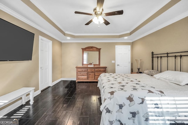 bedroom featuring baseboards, dark wood-style flooring, ceiling fan, crown molding, and a raised ceiling