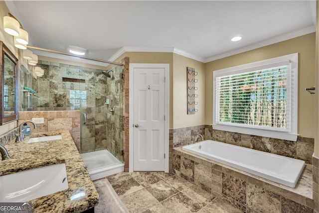 full bath featuring ornamental molding, a stall shower, and a sink