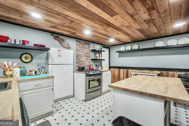 kitchen with open shelves, freestanding refrigerator, wood counters, wooden ceiling, and stainless steel gas range oven