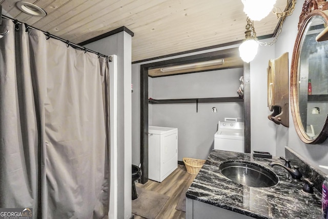 full bath featuring washer and clothes dryer, wood ceiling, vanity, and wood finished floors