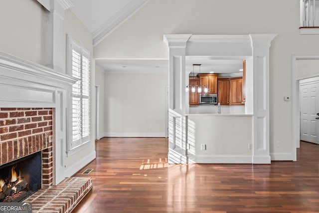 unfurnished living room with wood finished floors, visible vents, high vaulted ceiling, a fireplace, and crown molding
