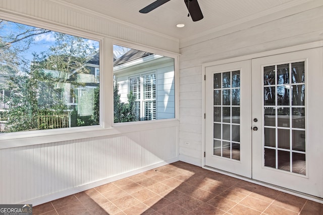 unfurnished sunroom with french doors