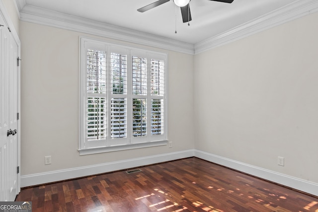unfurnished room featuring wood finished floors, baseboards, and ornamental molding