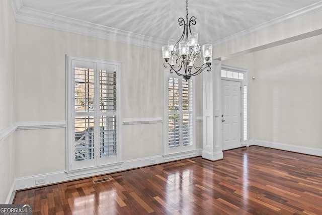unfurnished dining area featuring plenty of natural light, wood finished floors, and crown molding