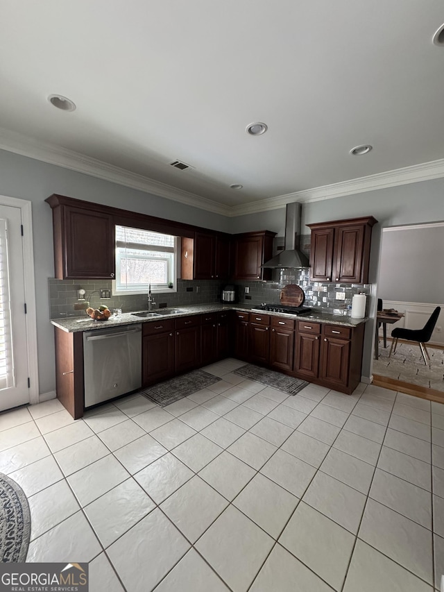 kitchen with gas cooktop, visible vents, a sink, stainless steel dishwasher, and wall chimney range hood