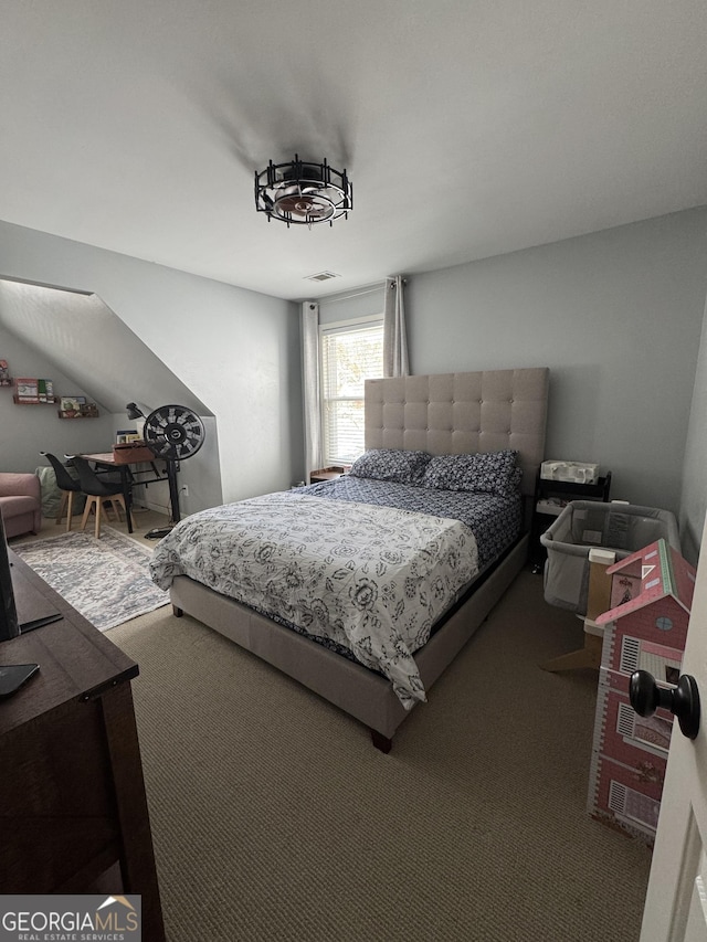 bedroom with visible vents and carpet flooring