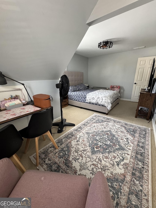 bedroom featuring carpet flooring, baseboards, and vaulted ceiling