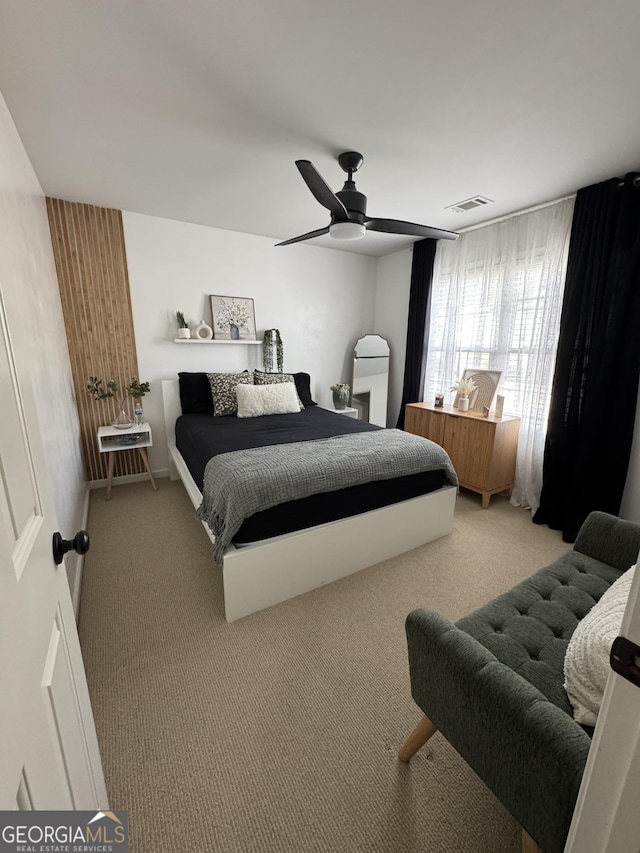 bedroom with visible vents, carpet floors, and ceiling fan