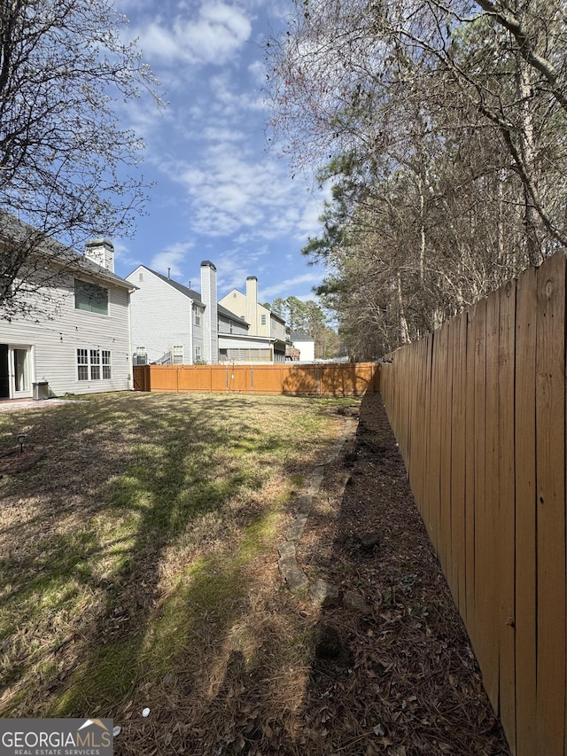 view of yard featuring a fenced backyard