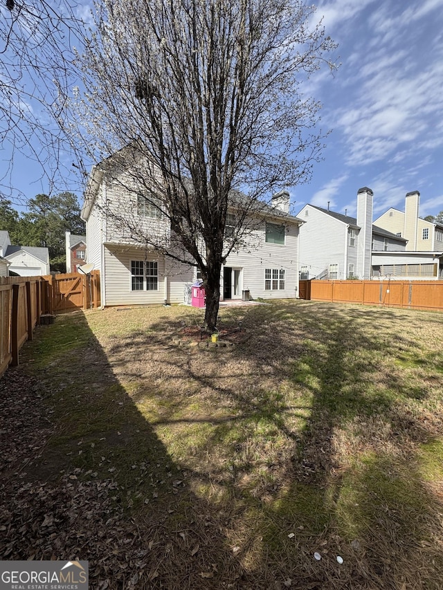 view of yard featuring a fenced backyard