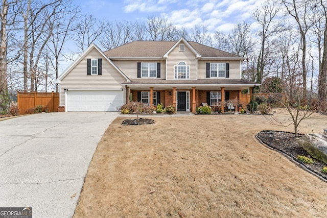 view of front facade featuring brick siding, fence, a porch, concrete driveway, and a garage