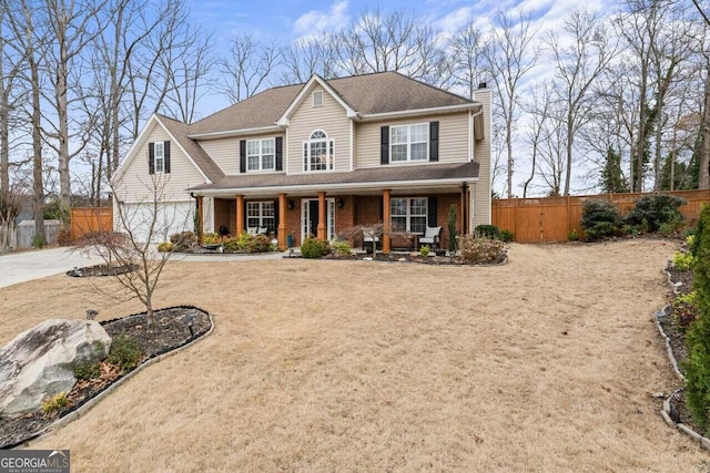 view of front of house with driveway, fence, covered porch, a garage, and a chimney