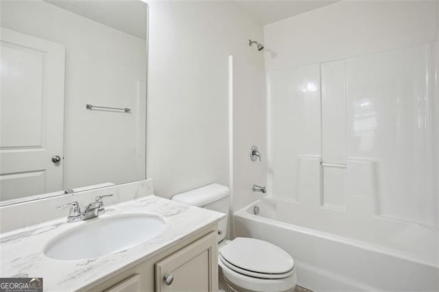 bathroom with vanity, toilet, and washtub / shower combination