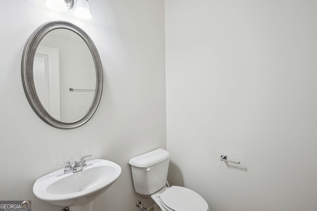 bathroom featuring a sink and toilet