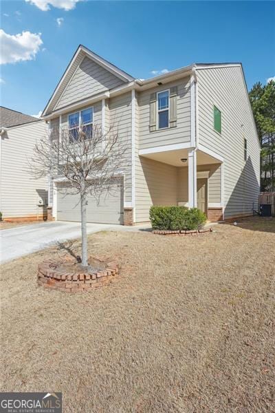 view of front facade with driveway and an attached garage