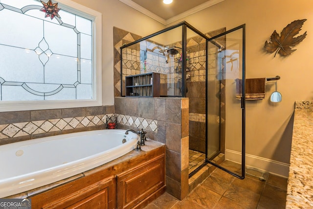 bathroom featuring crown molding, a garden tub, and a shower stall