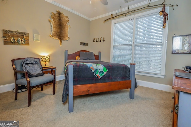 bedroom featuring multiple windows, baseboards, crown molding, and carpet