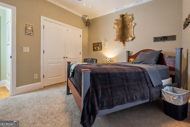 bedroom with baseboards, light carpet, a closet, and ornamental molding