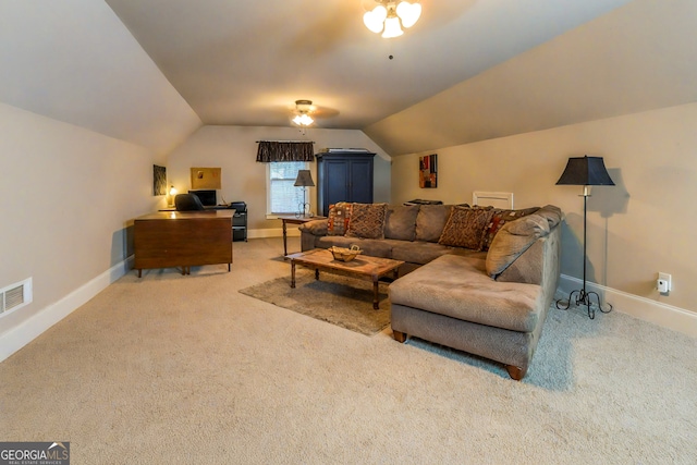 carpeted living room with visible vents, lofted ceiling, and baseboards