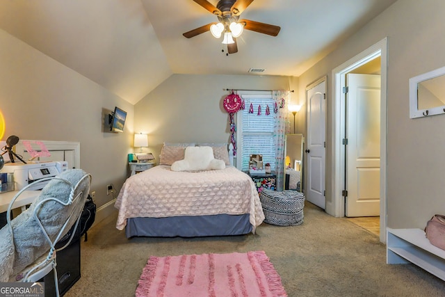 bedroom with lofted ceiling, ceiling fan, and carpet flooring