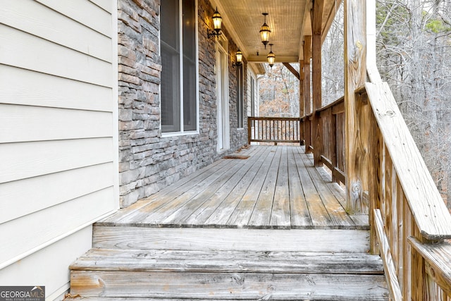 wooden deck featuring covered porch