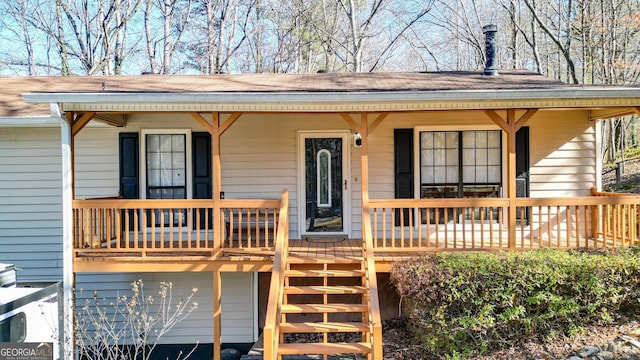 view of front of home with a porch and stairs