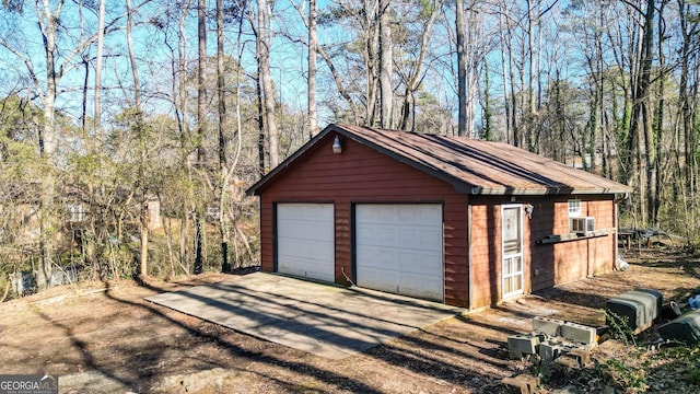 detached garage featuring cooling unit