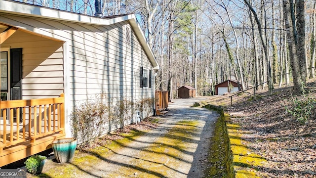 view of side of home with an outdoor structure