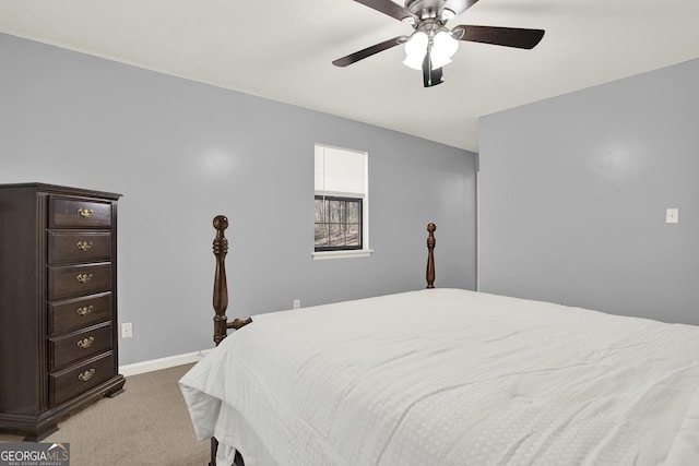 bedroom featuring a ceiling fan, baseboards, and light carpet