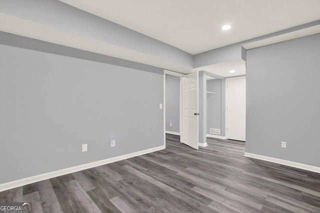 spare room featuring recessed lighting, visible vents, baseboards, and wood finished floors