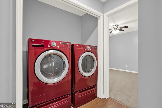 washroom featuring washer and clothes dryer, carpet floors, baseboards, ceiling fan, and laundry area