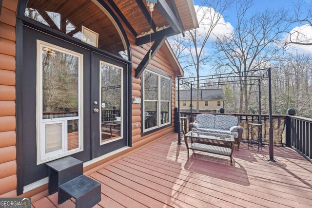 wooden deck with an outdoor hangout area