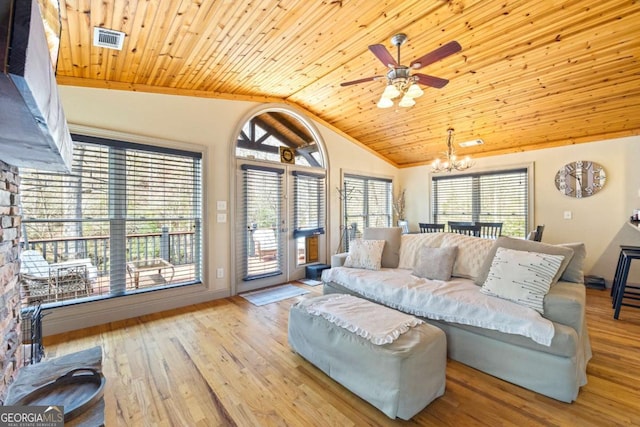 living area with visible vents, ceiling fan with notable chandelier, wood finished floors, lofted ceiling, and wood ceiling