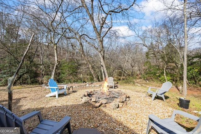 view of yard featuring a fire pit