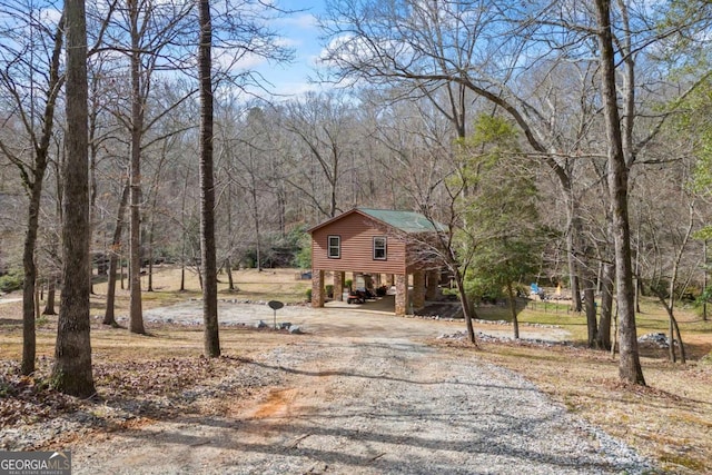 view of front of property with a carport and driveway