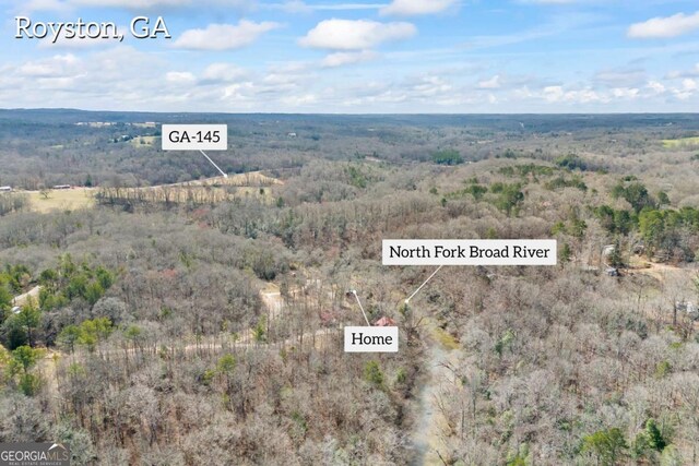 aerial view featuring a view of trees