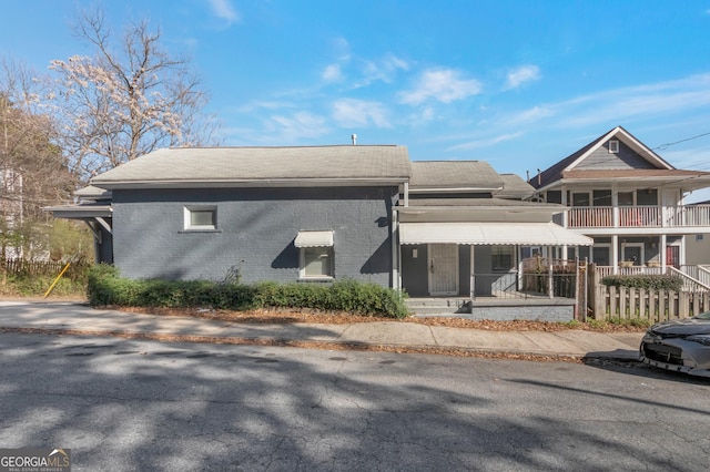 235 Dodd Ave SW, Atlanta, GA 30315 - back of house featuring brick siding, covered porch, and a shingled roof