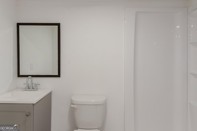 full bathroom with vanity and toilet