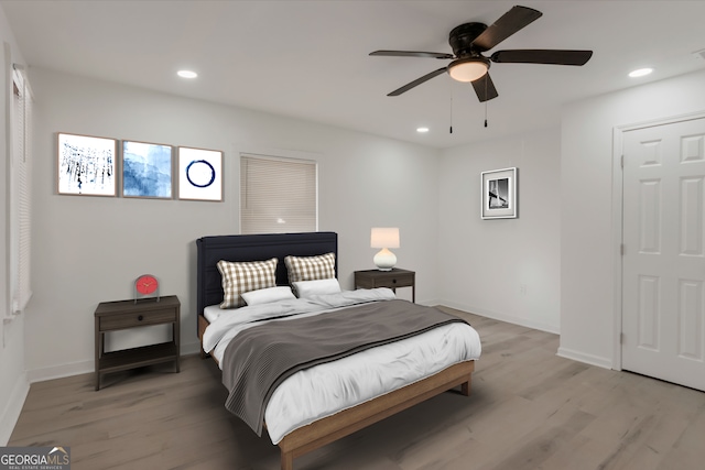 bedroom featuring recessed lighting and light wood-style floors