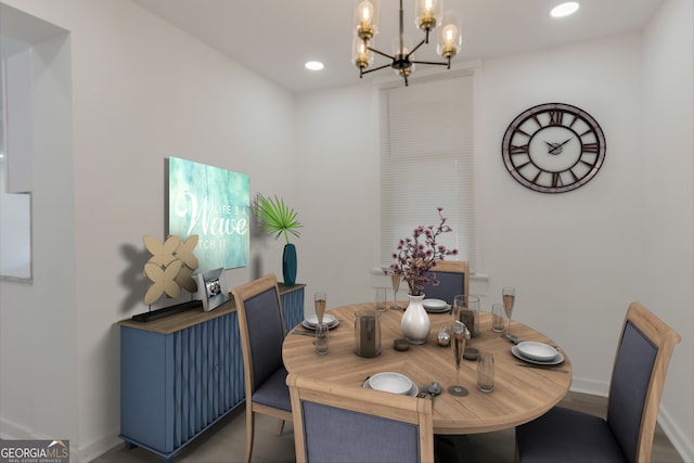 dining room with recessed lighting, baseboards, and an inviting chandelier