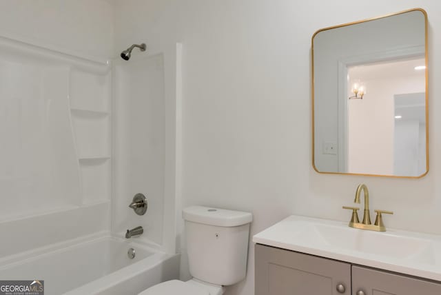 bathroom featuring shower / bathing tub combination, toilet, and vanity