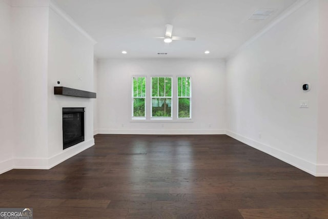 unfurnished living room with recessed lighting, a fireplace, baseboards, and wood finished floors