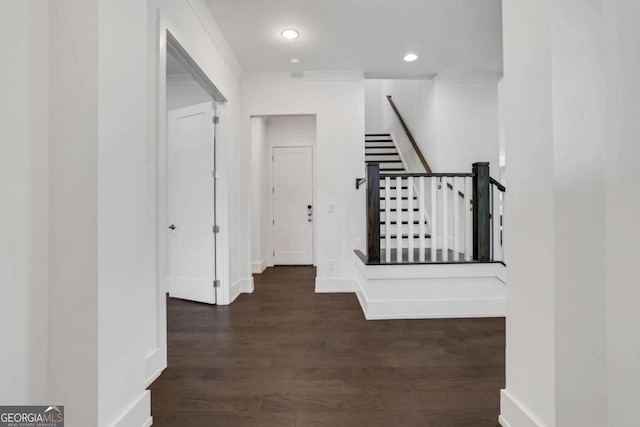 hall featuring recessed lighting, stairway, baseboards, and dark wood-type flooring