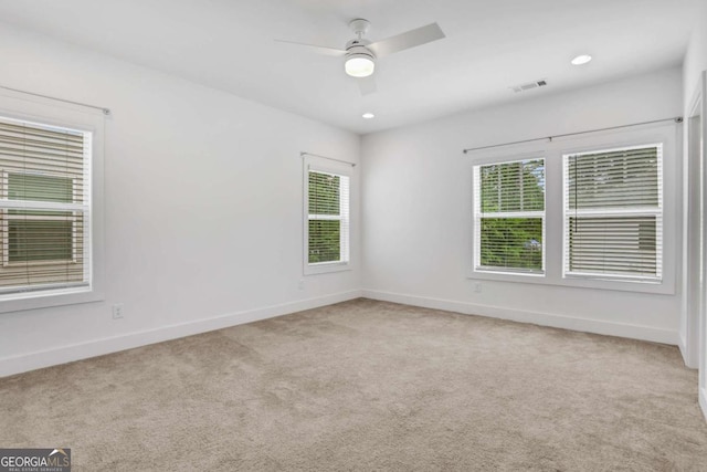 carpeted empty room with recessed lighting, baseboards, visible vents, and ceiling fan